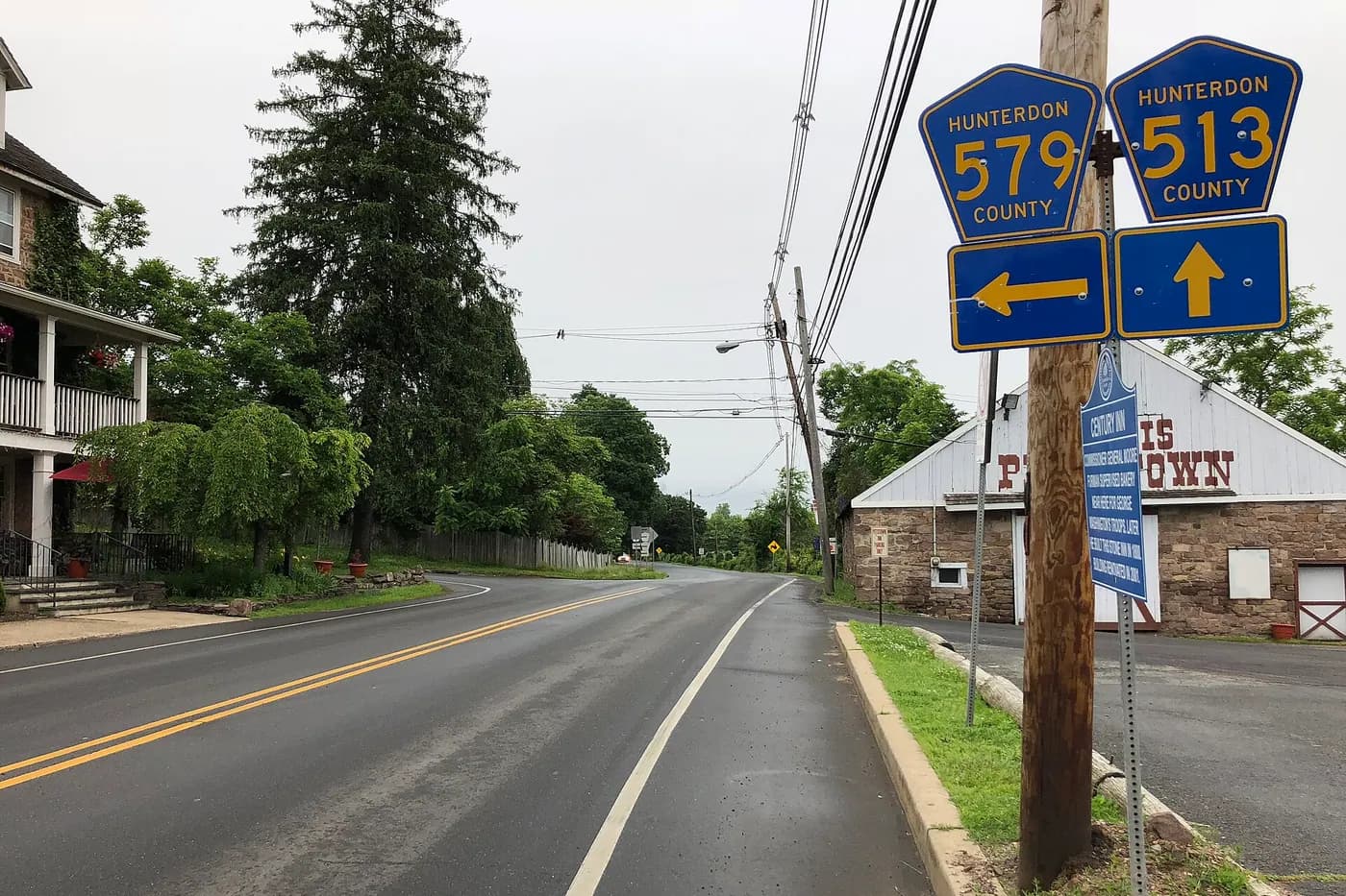 Rural two-lane road running between open farmland in Alexandria Township, New Jersey